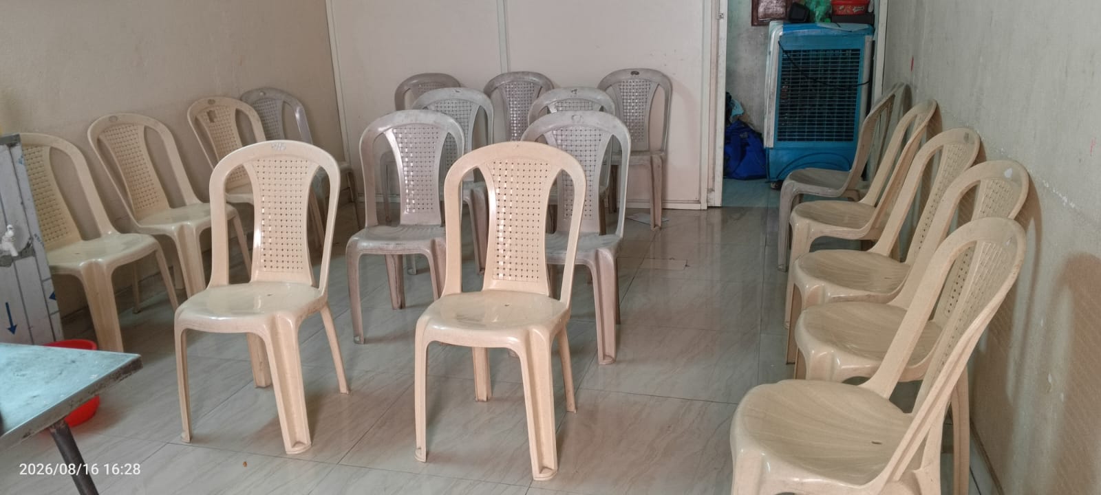 Common hall with seating for residents at Amigos Gents Hostel, Labbipet, Vijayawada