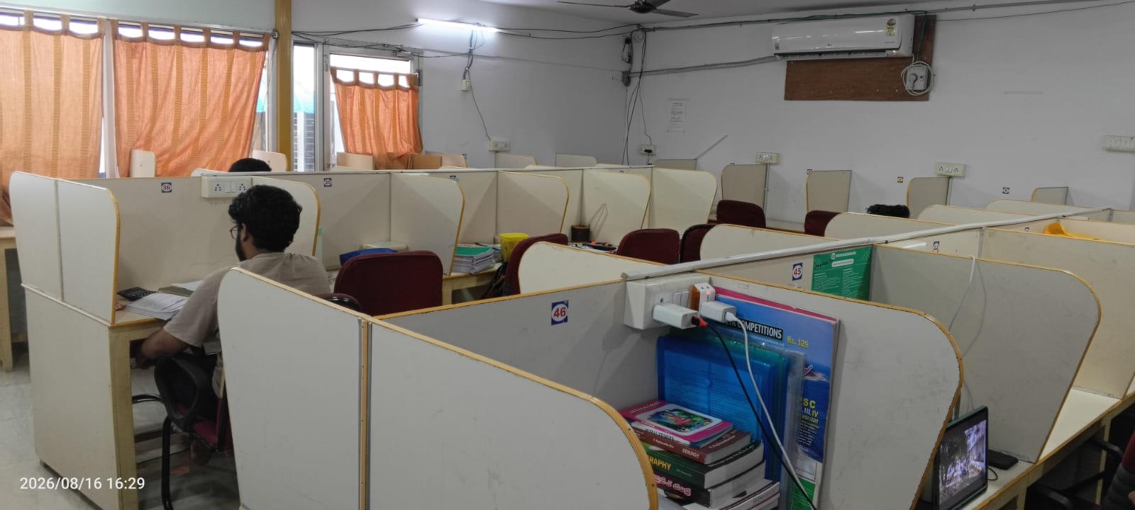 Air-conditioned reading hall with individual cabins at Amigos Gents Hostel, Labbipet, Vijayawada